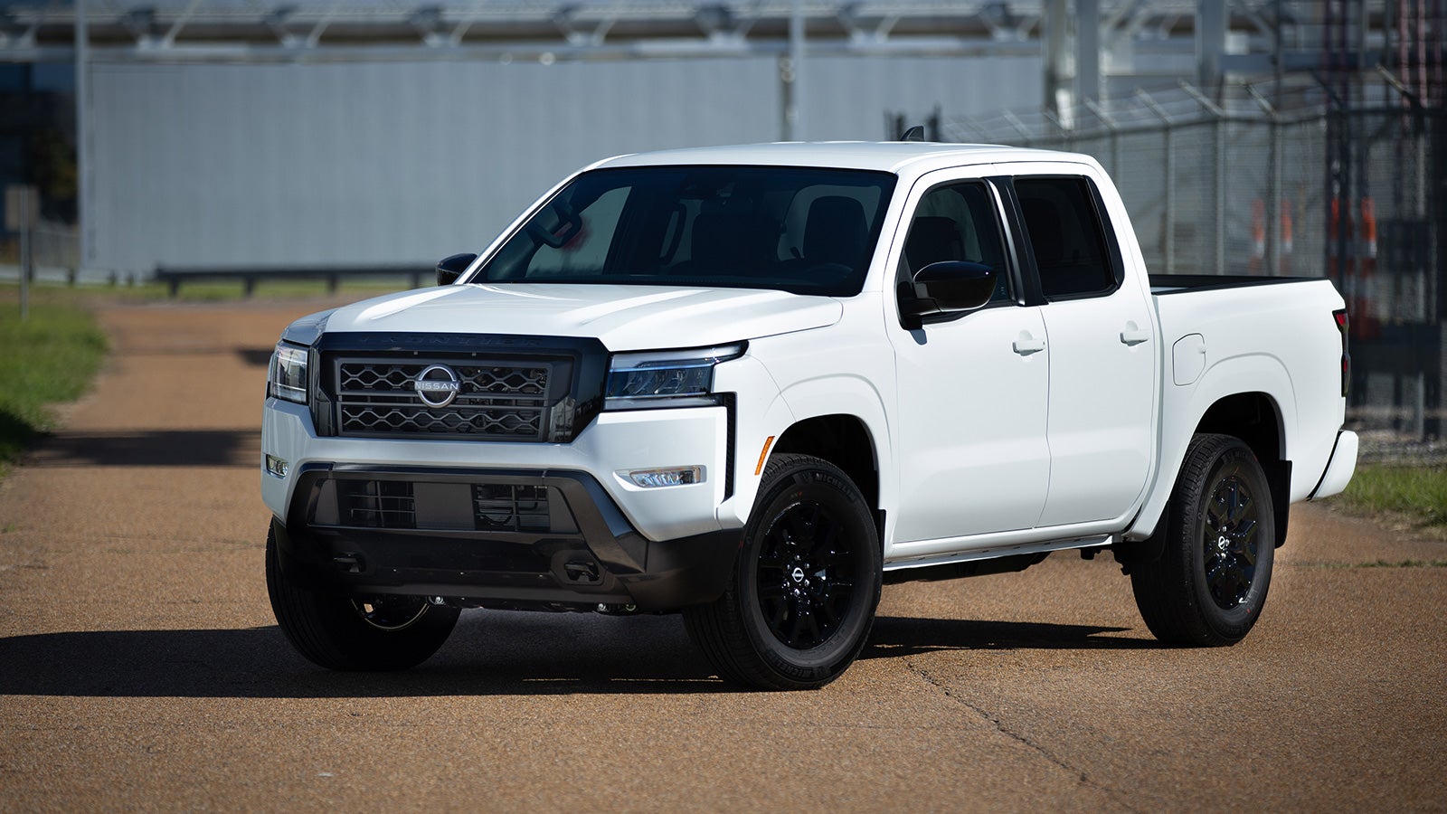 Front view of the white 2023 Nissan Frontier